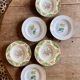 Set of 6 mismatched antique deep plates.
