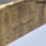 Empty pocket brutalist-inspired ashtray in gilded bronze