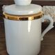 2 white and gold Limoges porcelain tea cups