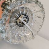 Table lamp made of transparent crystal glass and silver colored spacers.