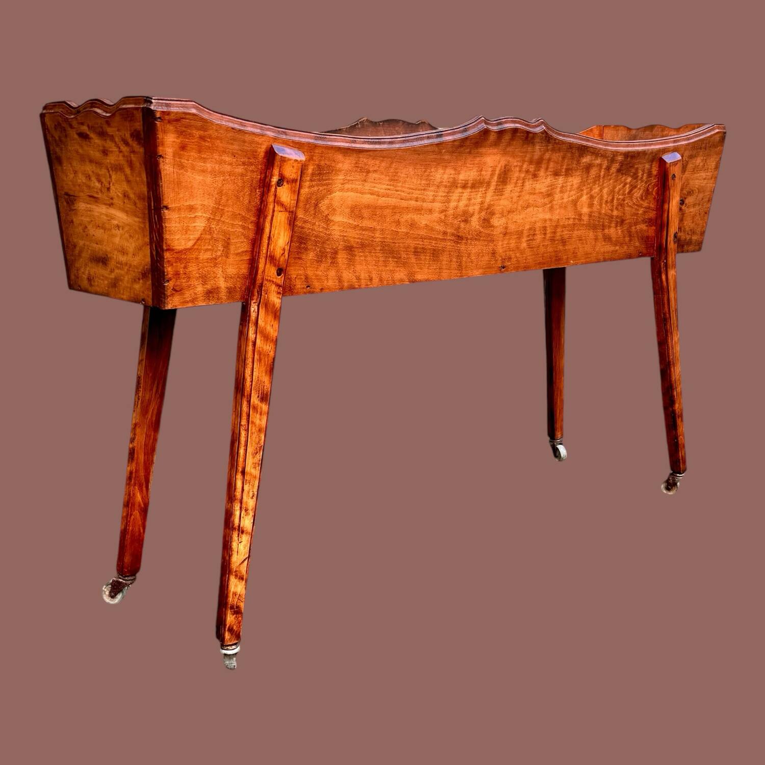 Old indoor planter on wheels