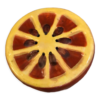 Vintage salt shaker in the shape of an orange marked ermetic