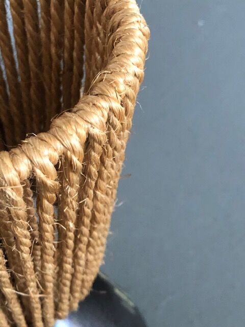 Brutalist style laying lamp with rope lampshade and ceramic foot