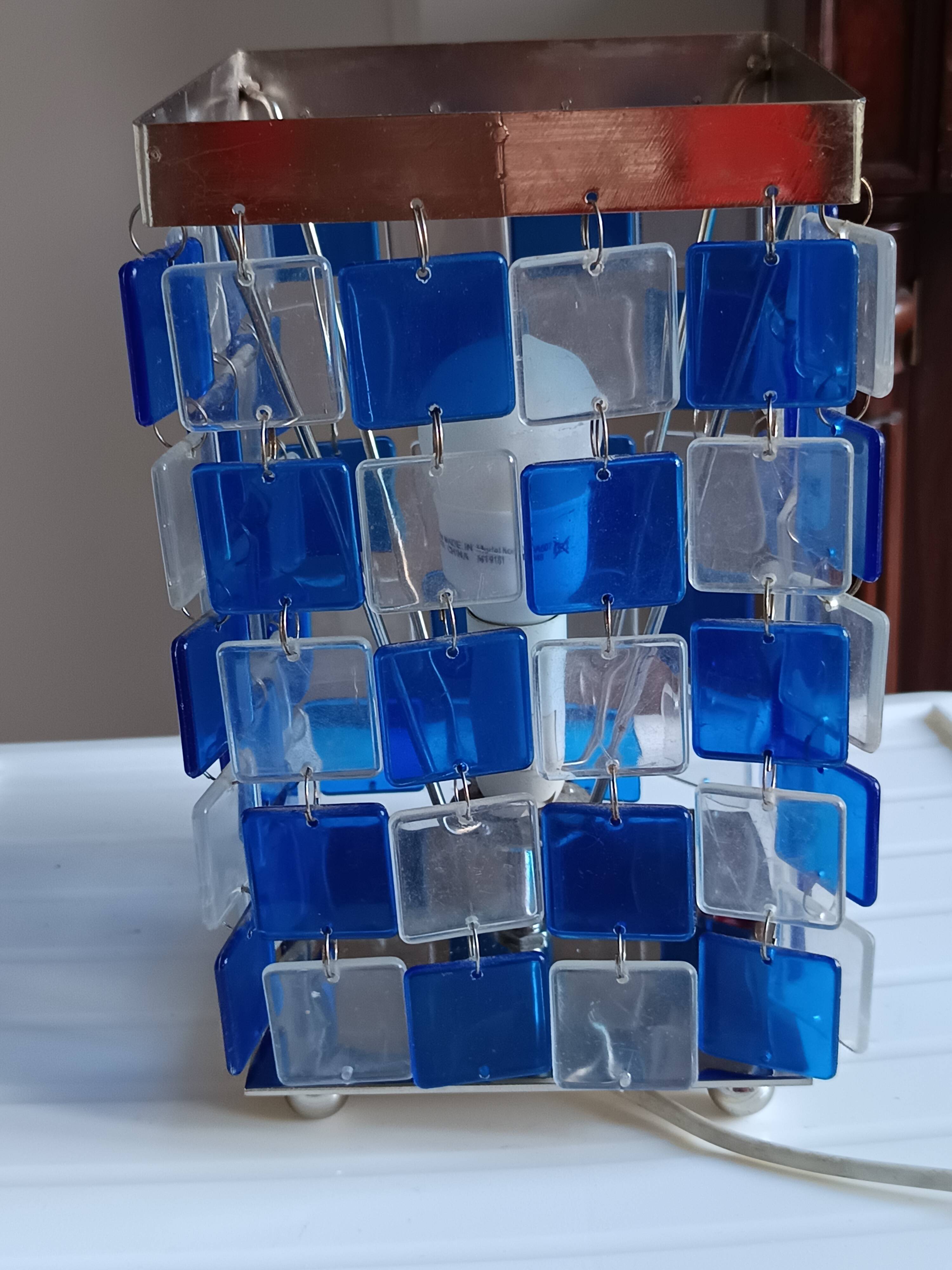 1970s designer table lamp with blue and clear plexiglass pendants.