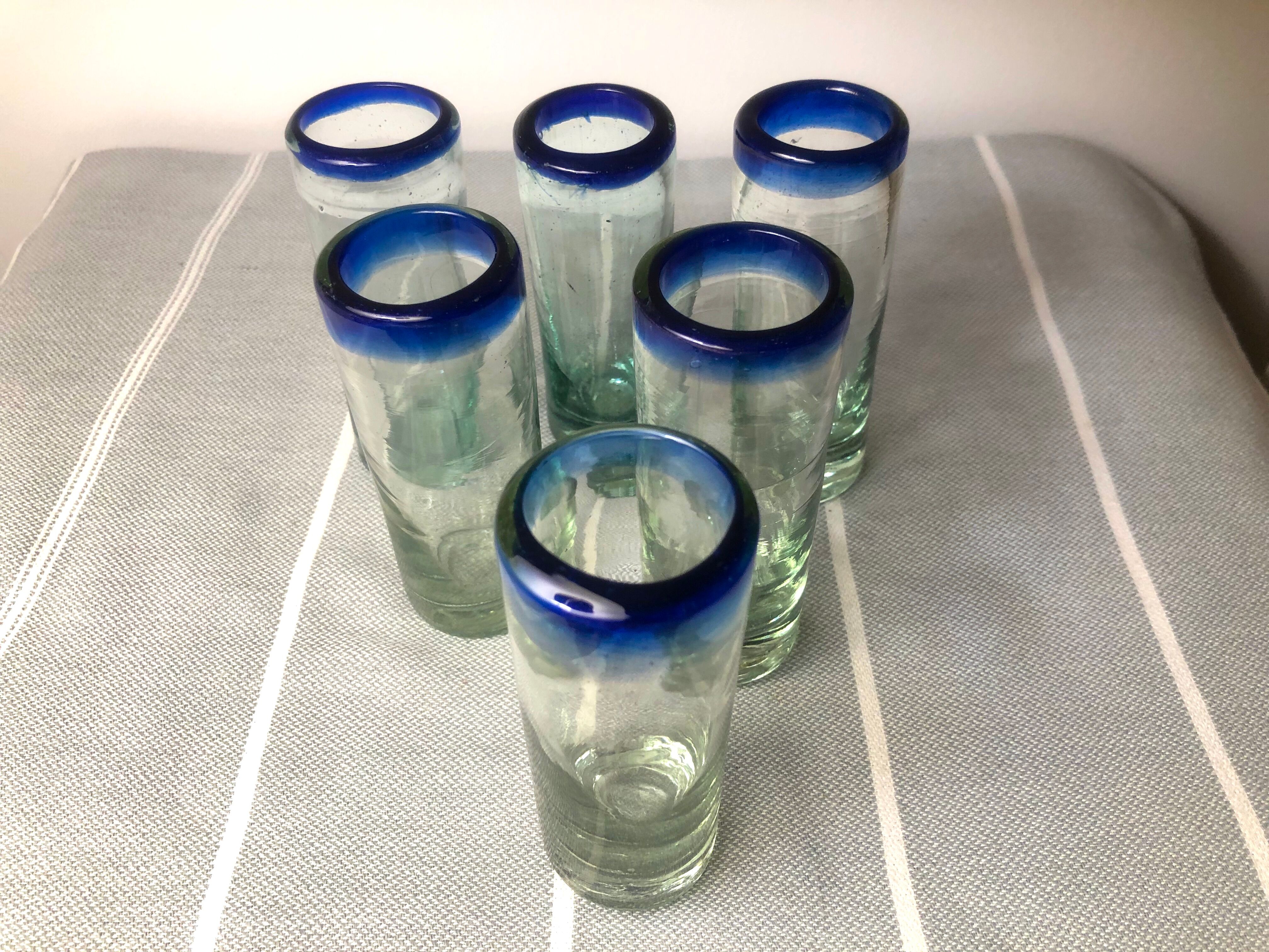 Handmade cobalt blue tequila glasses made of recycled glass