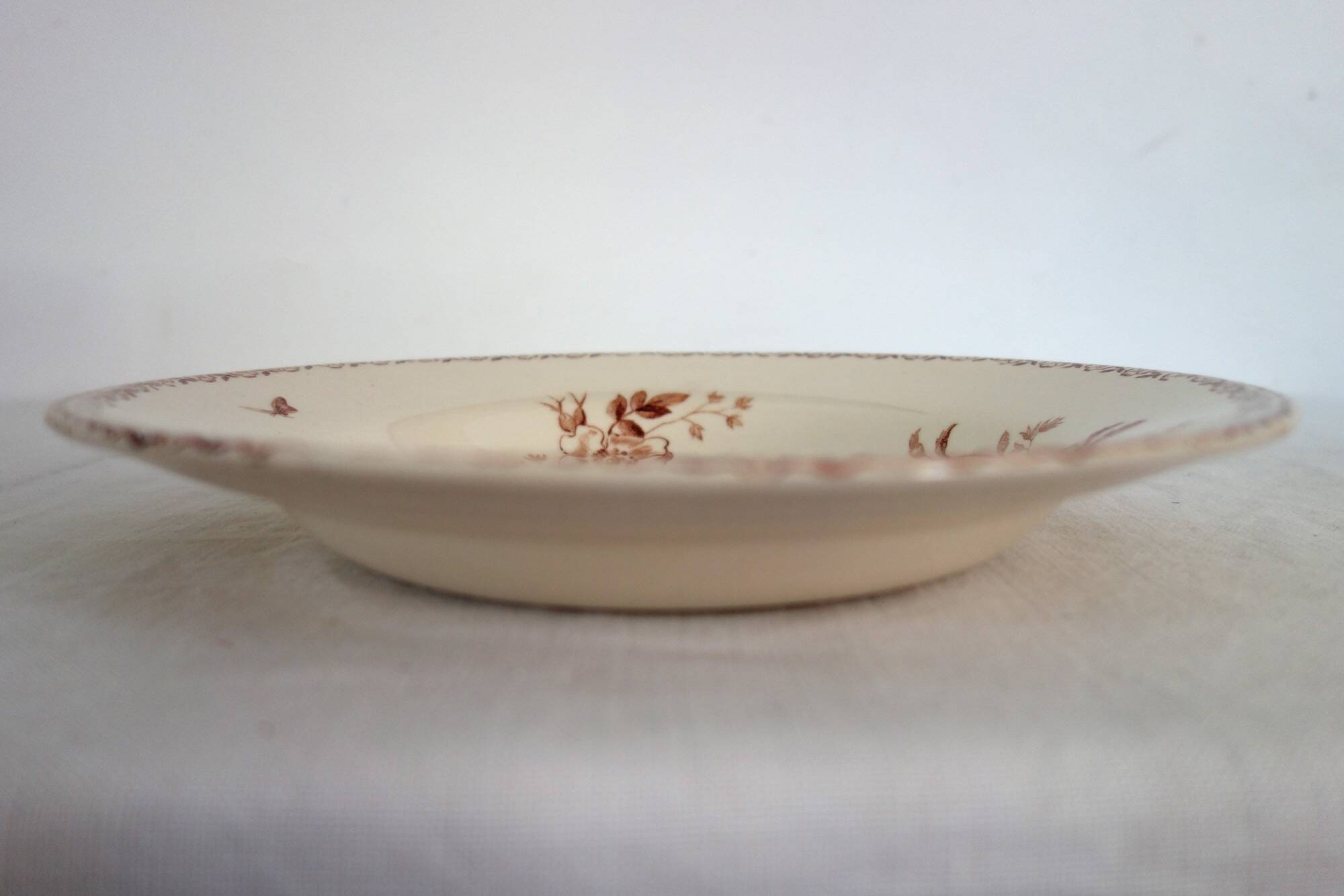 11 deep plates Terre De Fer Gien model Mai circa 1900