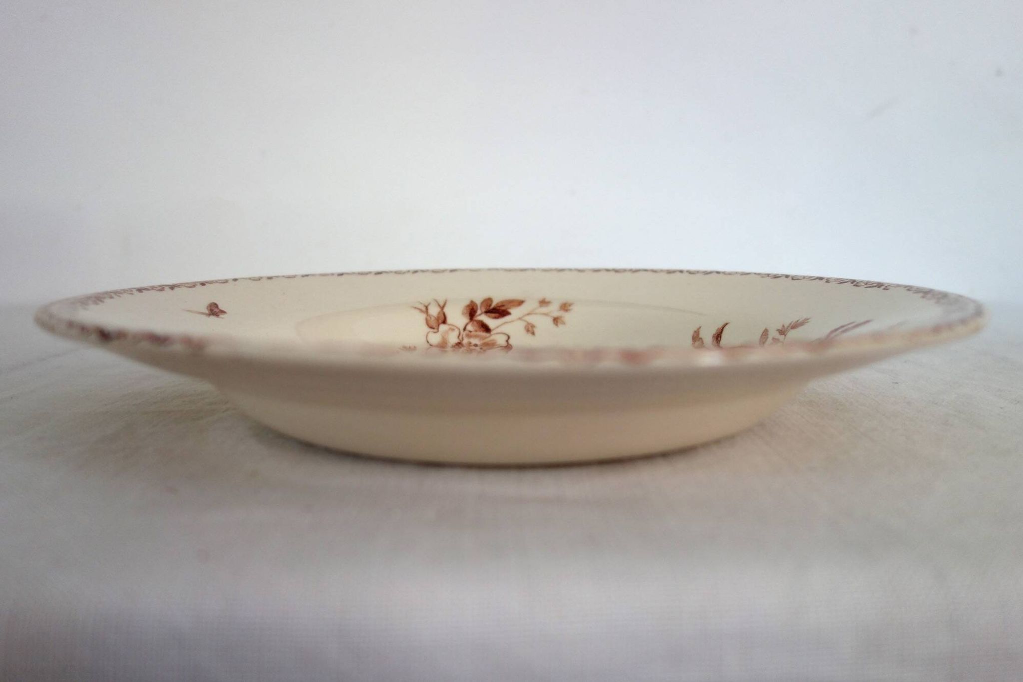 11 deep plates Terre De Fer Gien model Mai circa 1900