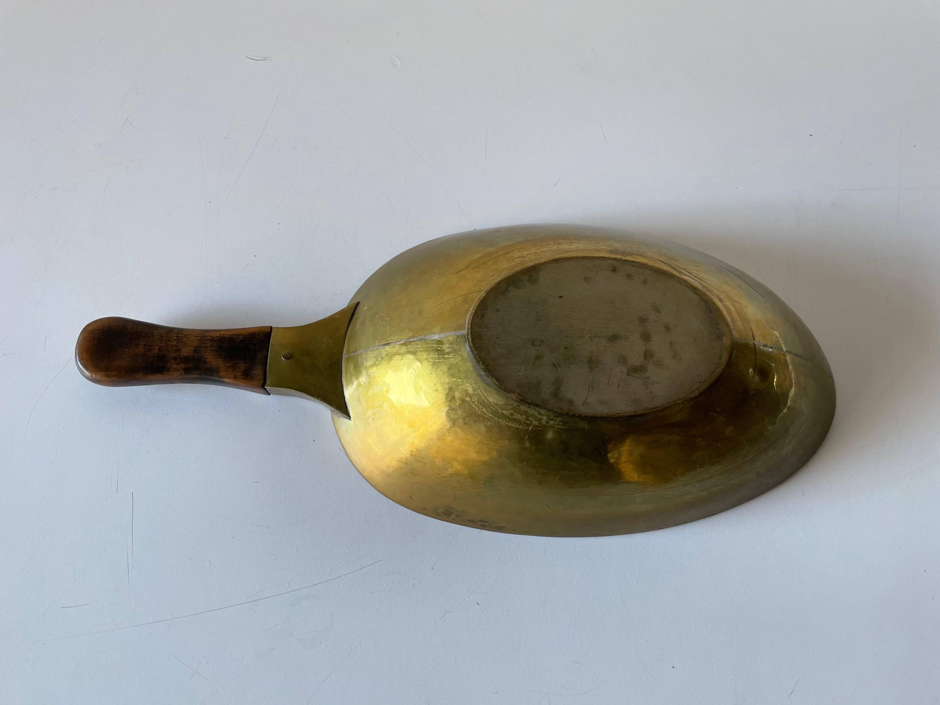 Decorative brass bowl with wooden handle, 1970s, Turin, Italy.
