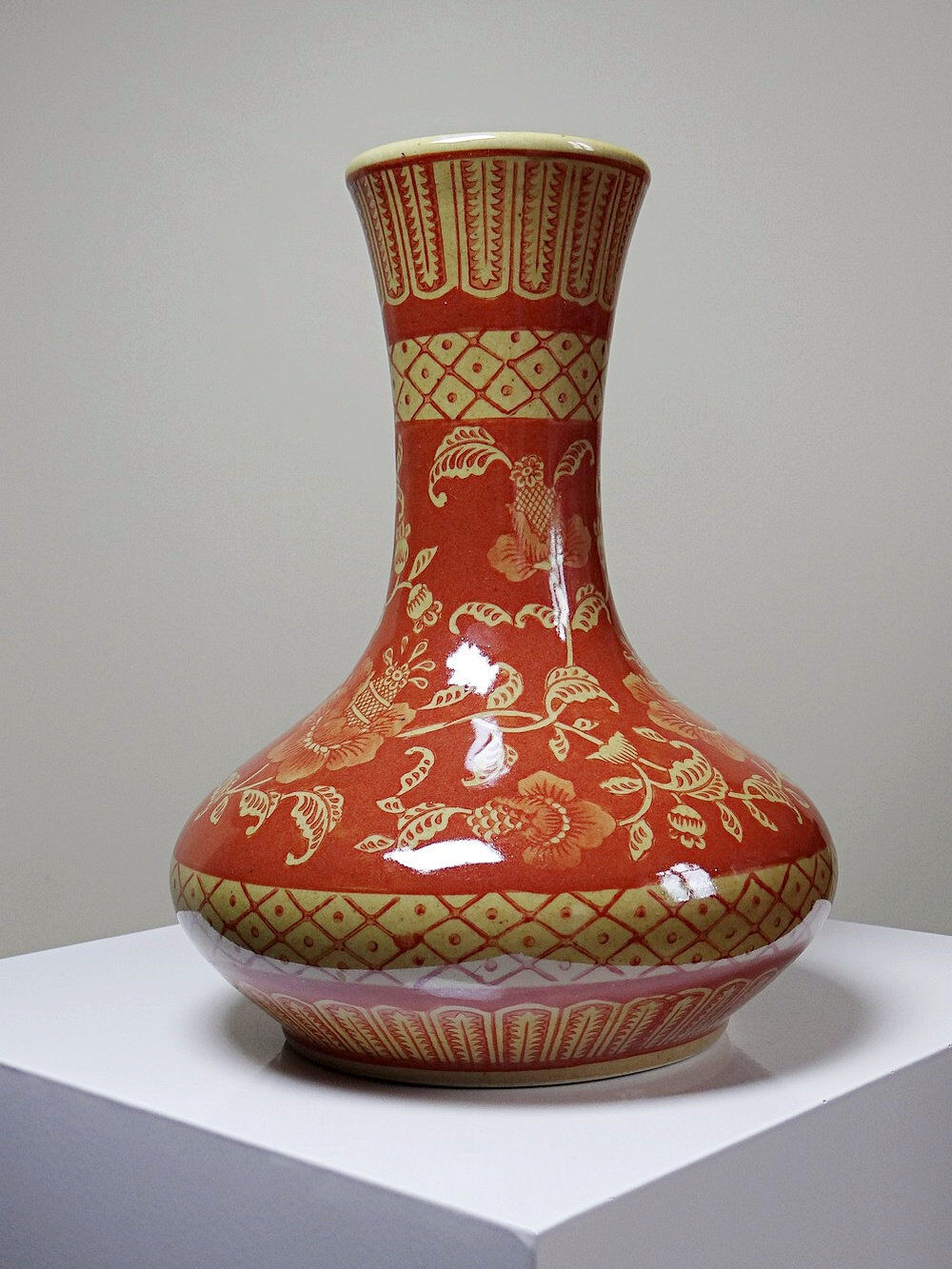 20th century Chinese vase, hand-painted ceramic in an unusual red hue.