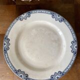 Ancien plat sur pied terre de fer en faïence de Salins