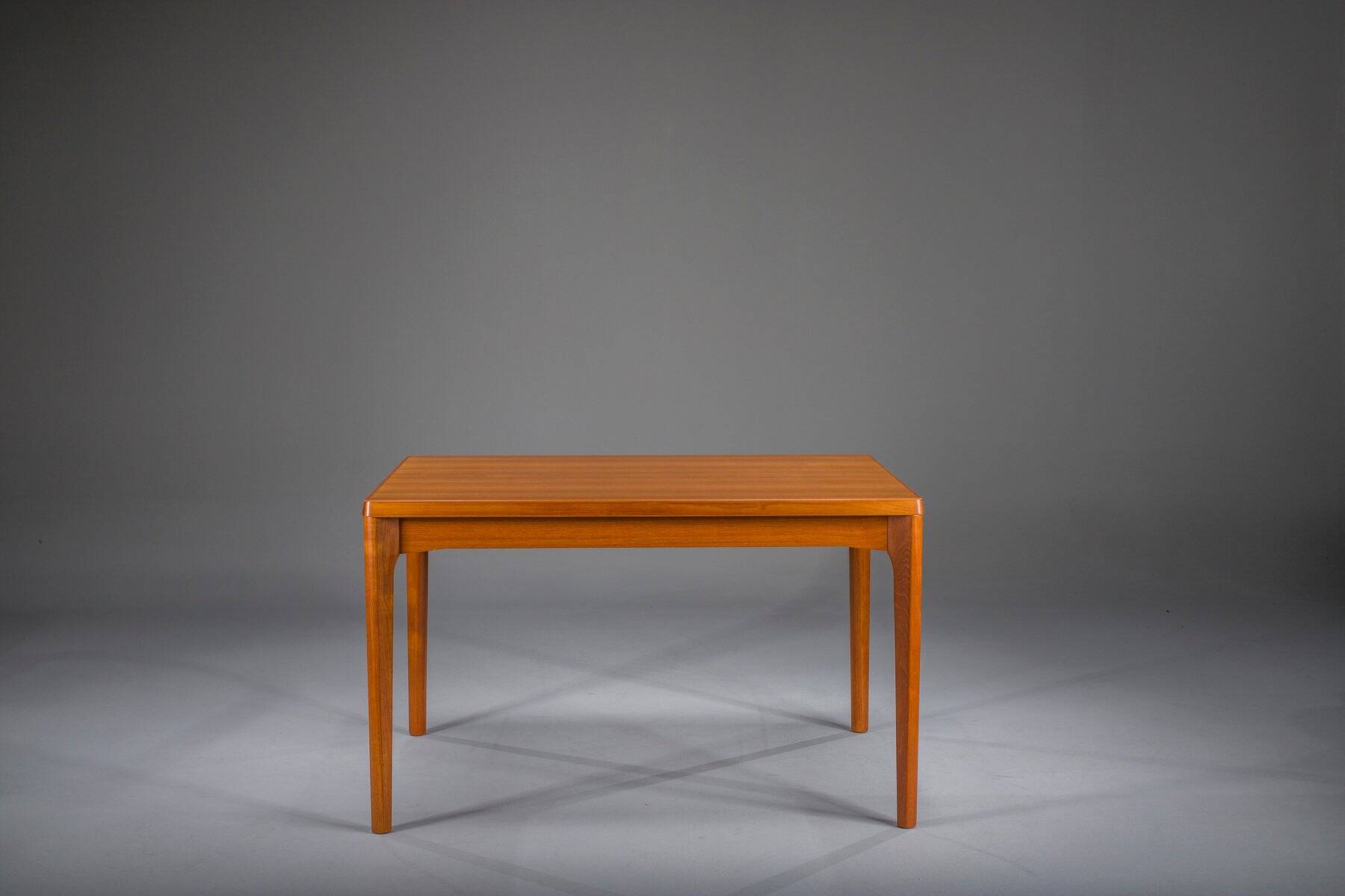 Extendable teak dining table by Henning Kjaernulf for Vejle Stole & Møbelfabrik