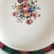 4 mismatched flat plates with floral patterns. Porcelain. Stamped