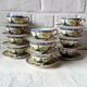 Vintage Japanese fine porcelain tea set with landscape pattern.
