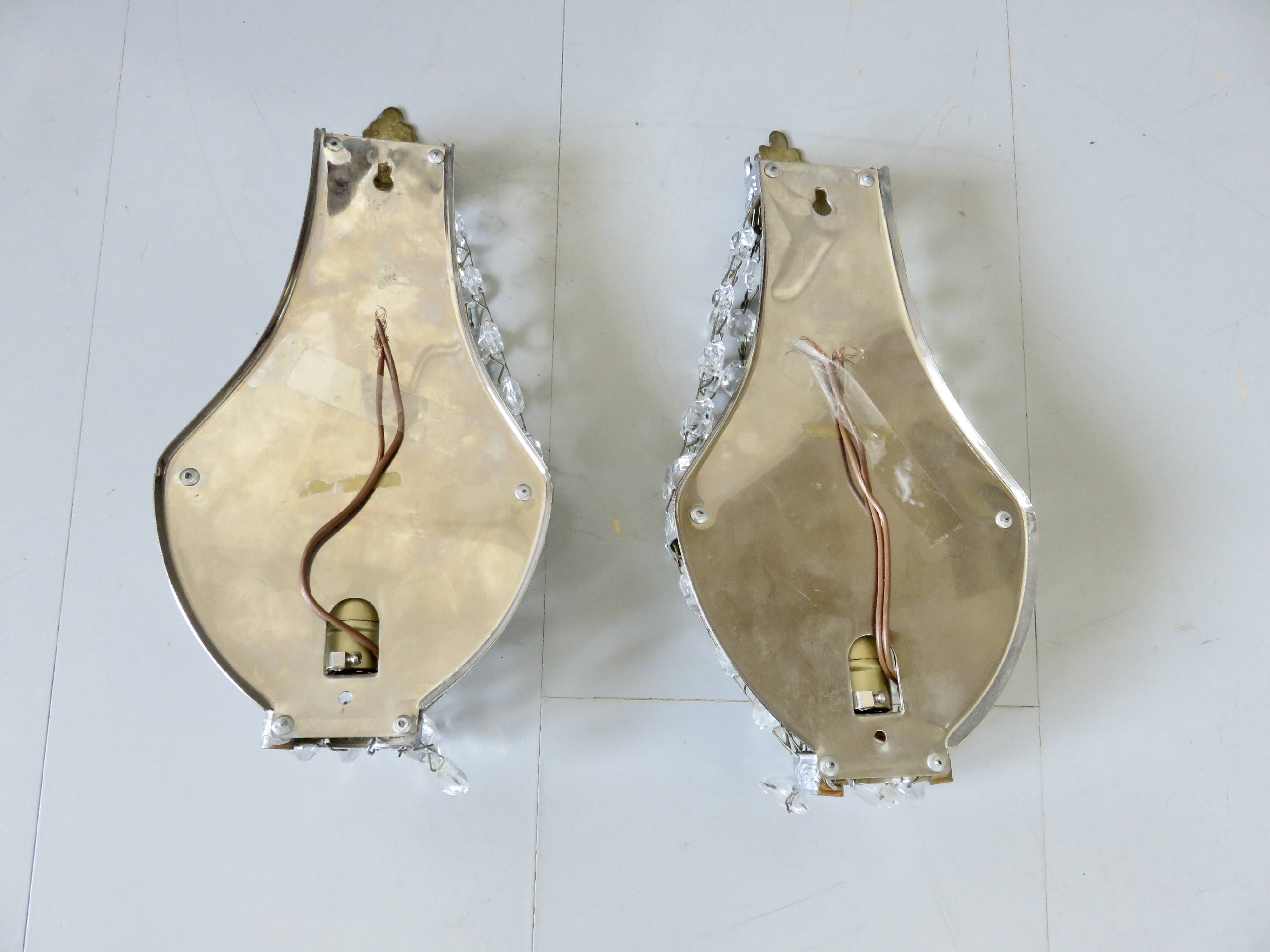 Pair of silver-plated balloon wall lights with pendants, circa 1970.