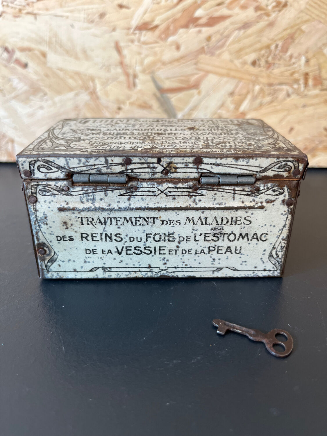 Old metal and wood medicine box with key