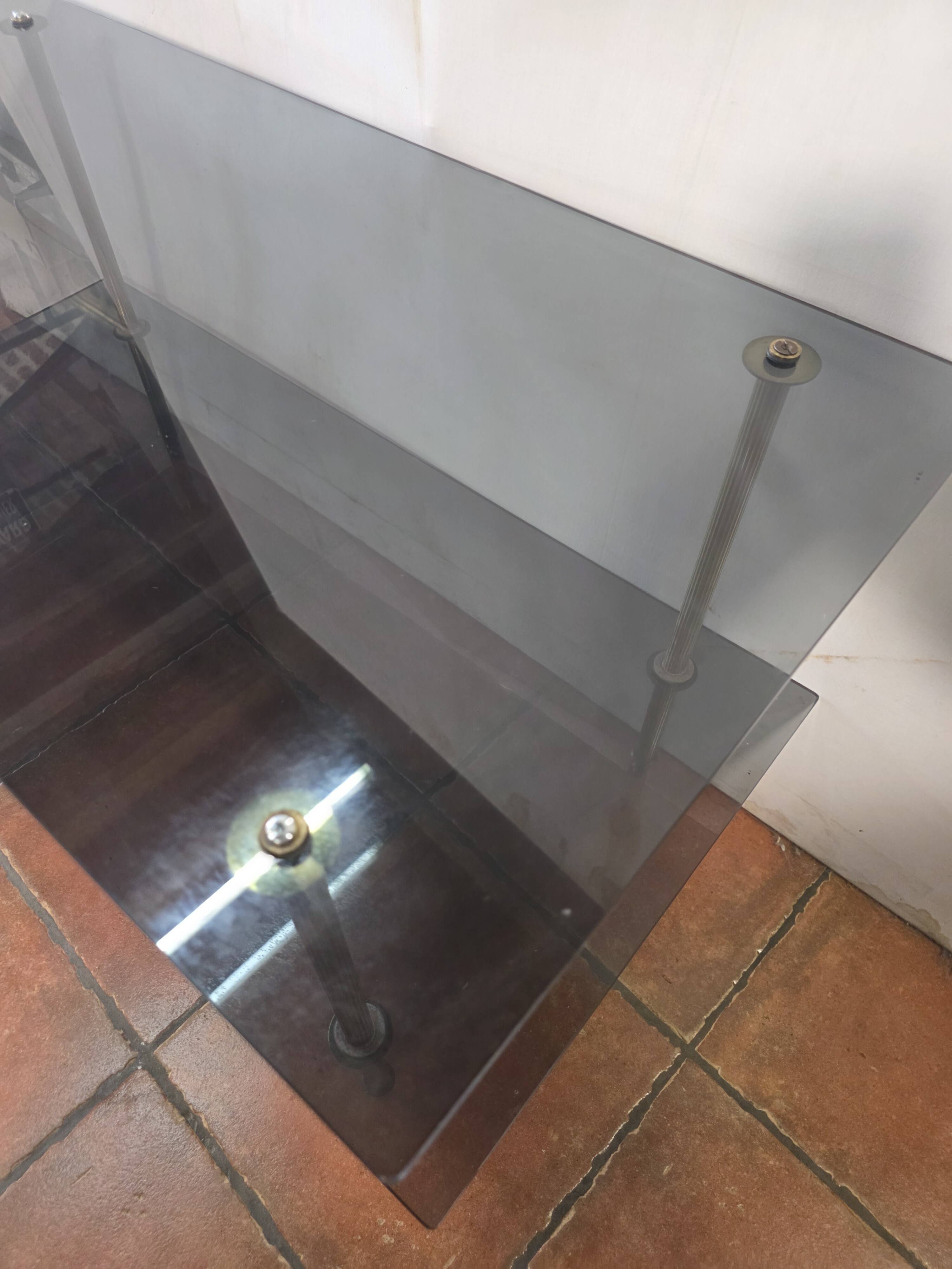 Smoked glass and brass coffee table from the 1970s.