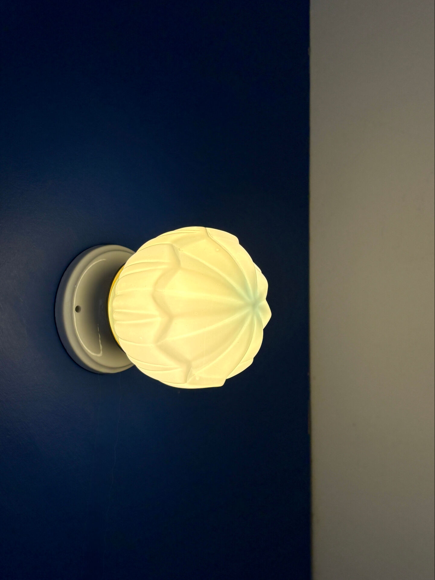 Vintage Art Deco globe wall light in blue opaline.