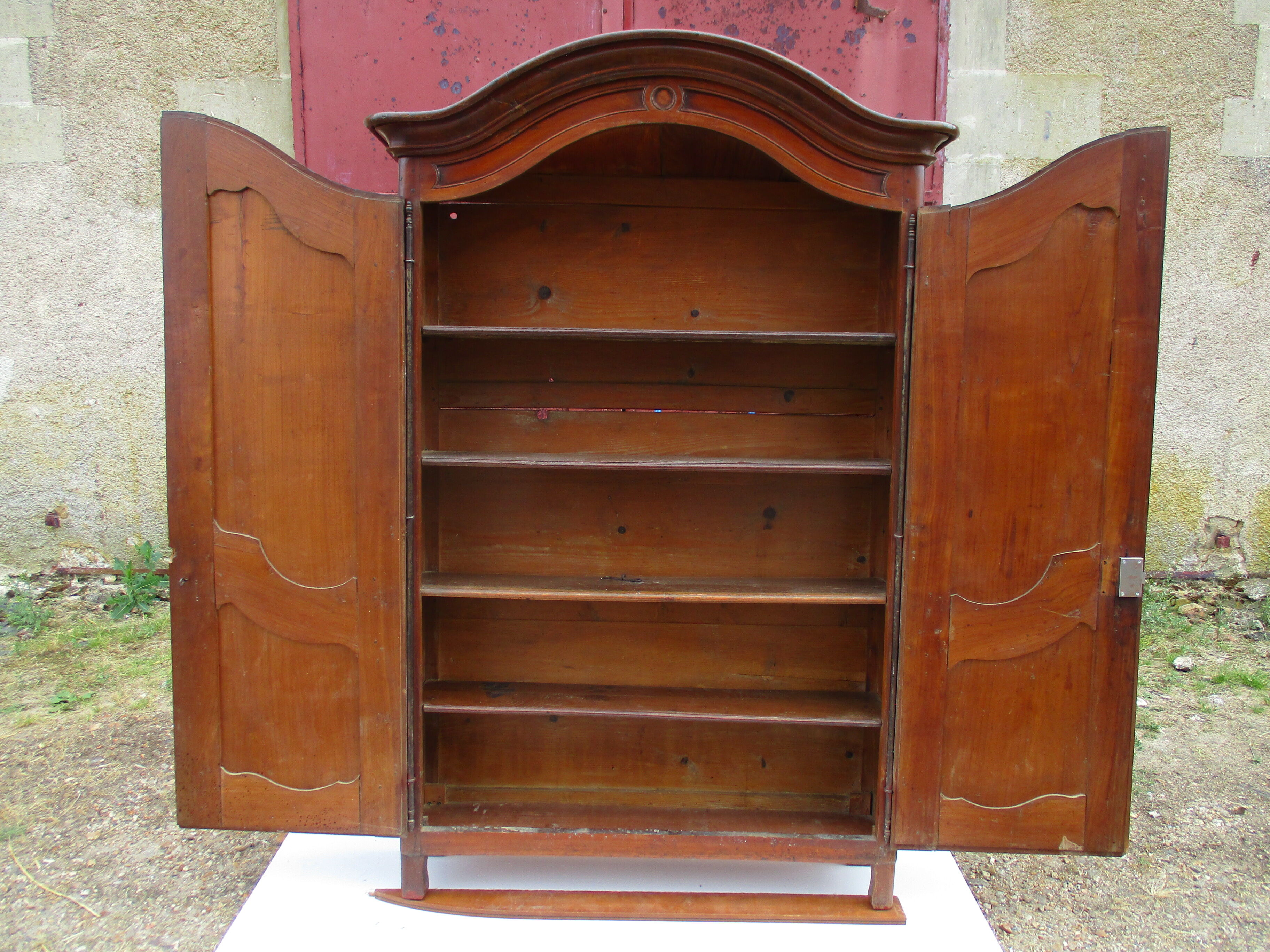 Small solid wooden cabinet with a gendarme hat