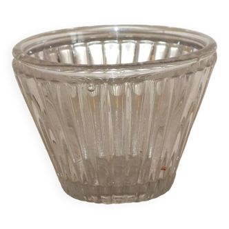 Old conical glass jam jar with vertical streaks