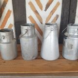 Set of 4 old metal milk canister jars
