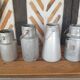 Set of 4 old metal milk canister jars