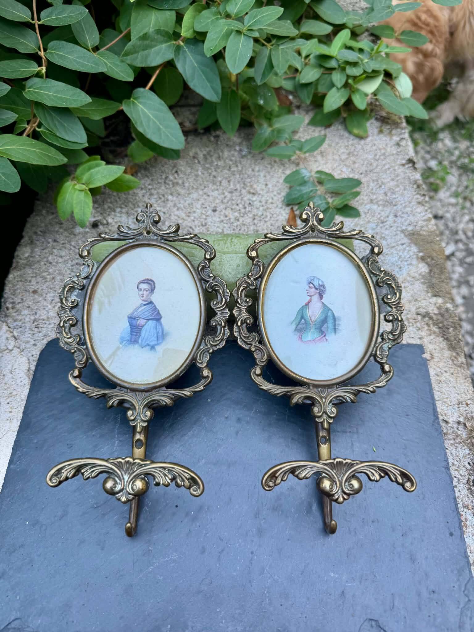 Pair of baroque brass coat hooks