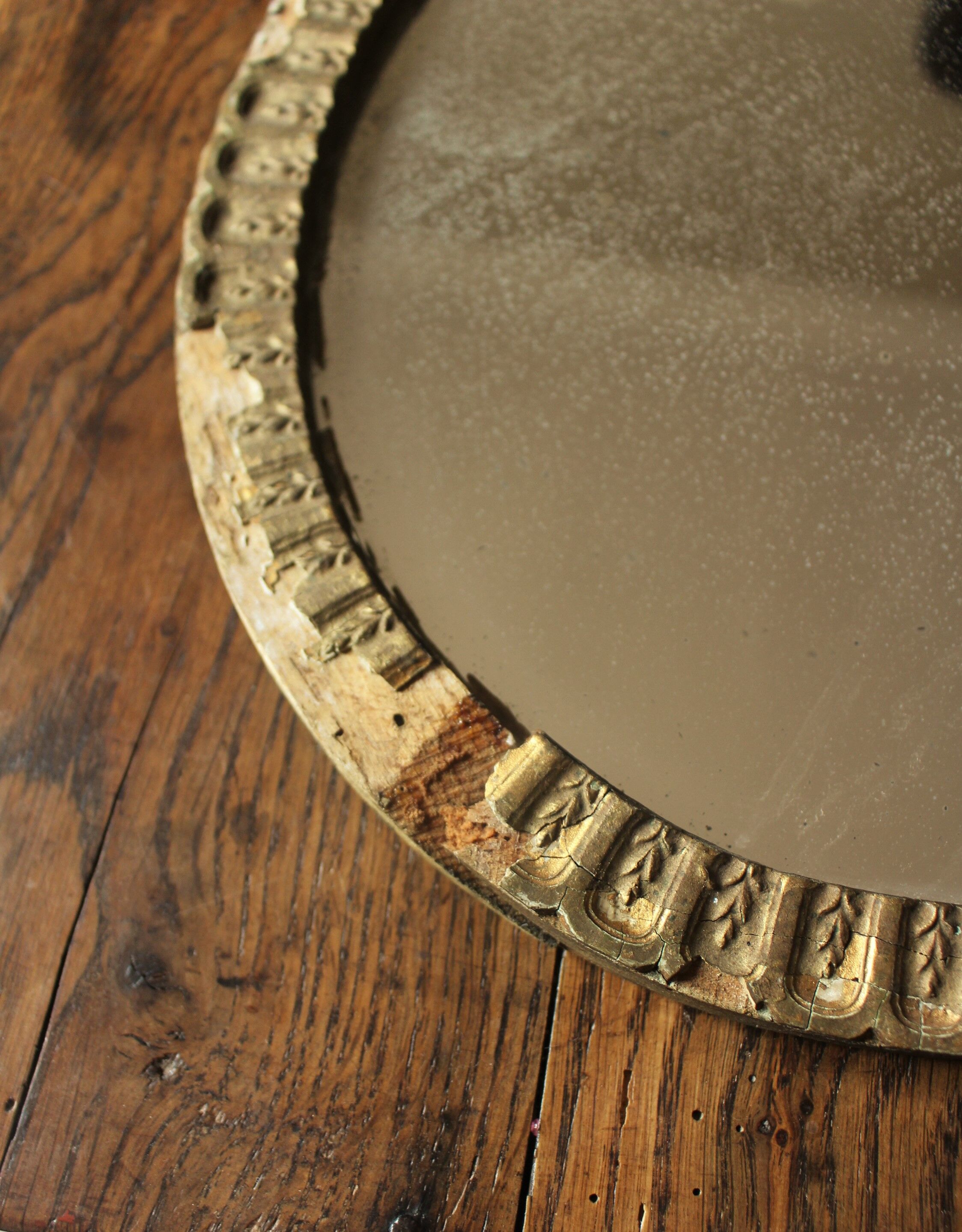 Old oval mirror gilded wood mercurized
