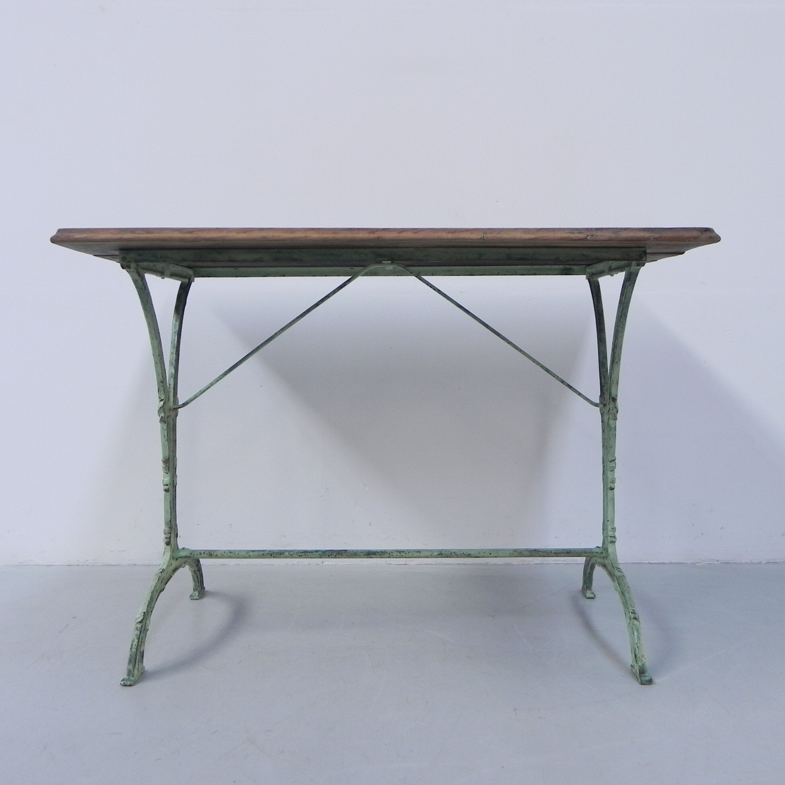 Art nouveau bistro table with cast iron frame