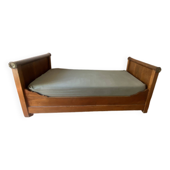 WALNUT AND BRONZE BOAT BED WITH BEDDING