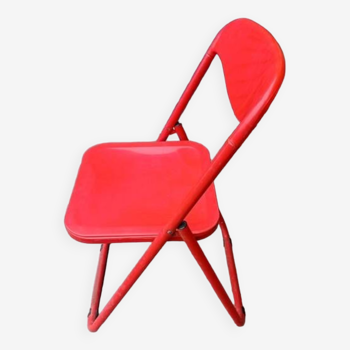 Red designer folding chairs from the 70s