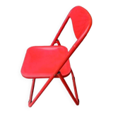 Red designer folding chairs from the 70s