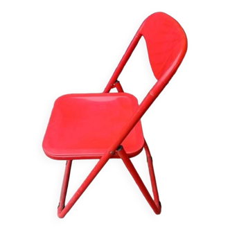 Red designer folding chairs from the 70s