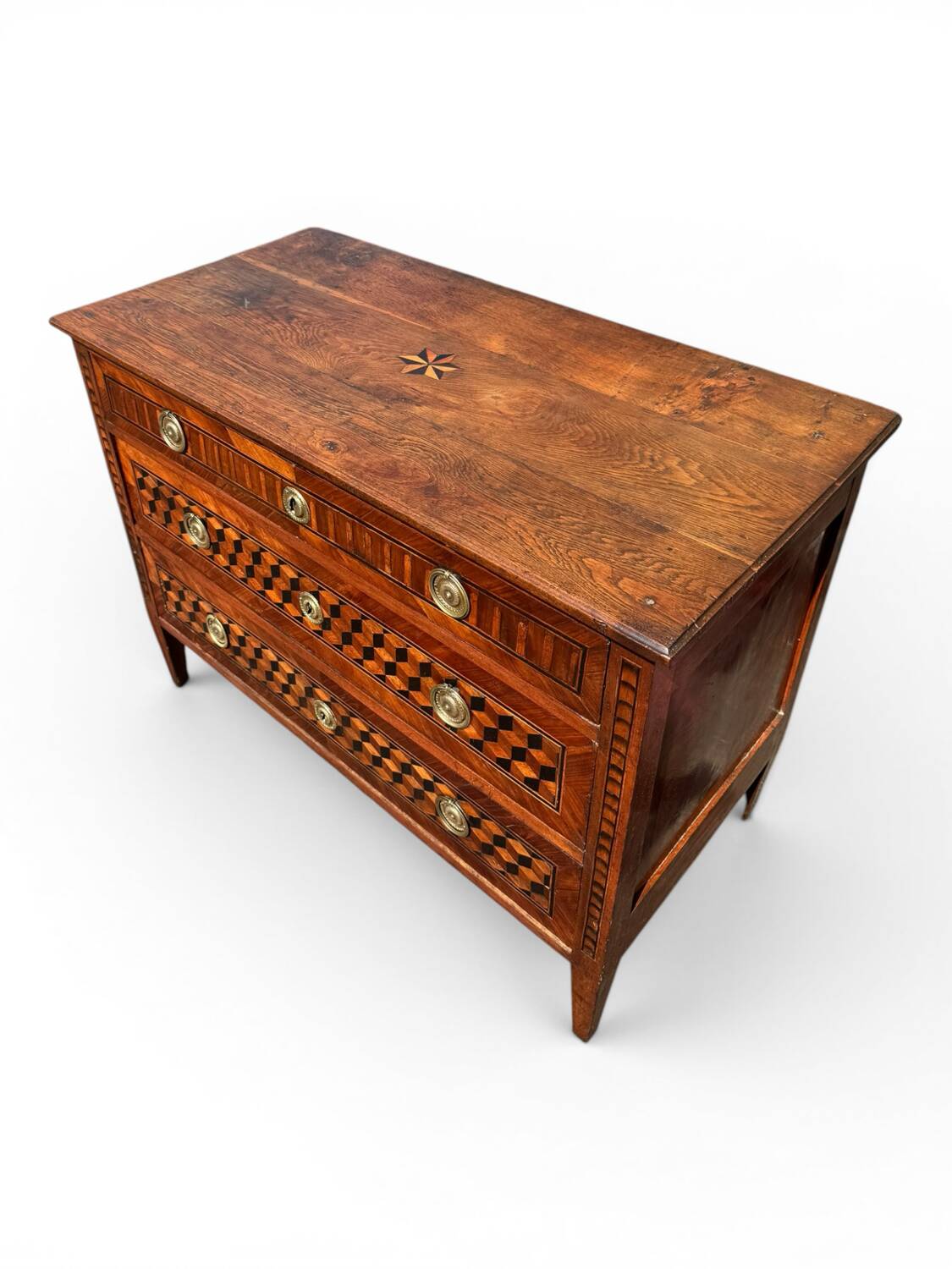 Louis XVI commode with marquetry featuring a design of precious wood cubes, 18th century.