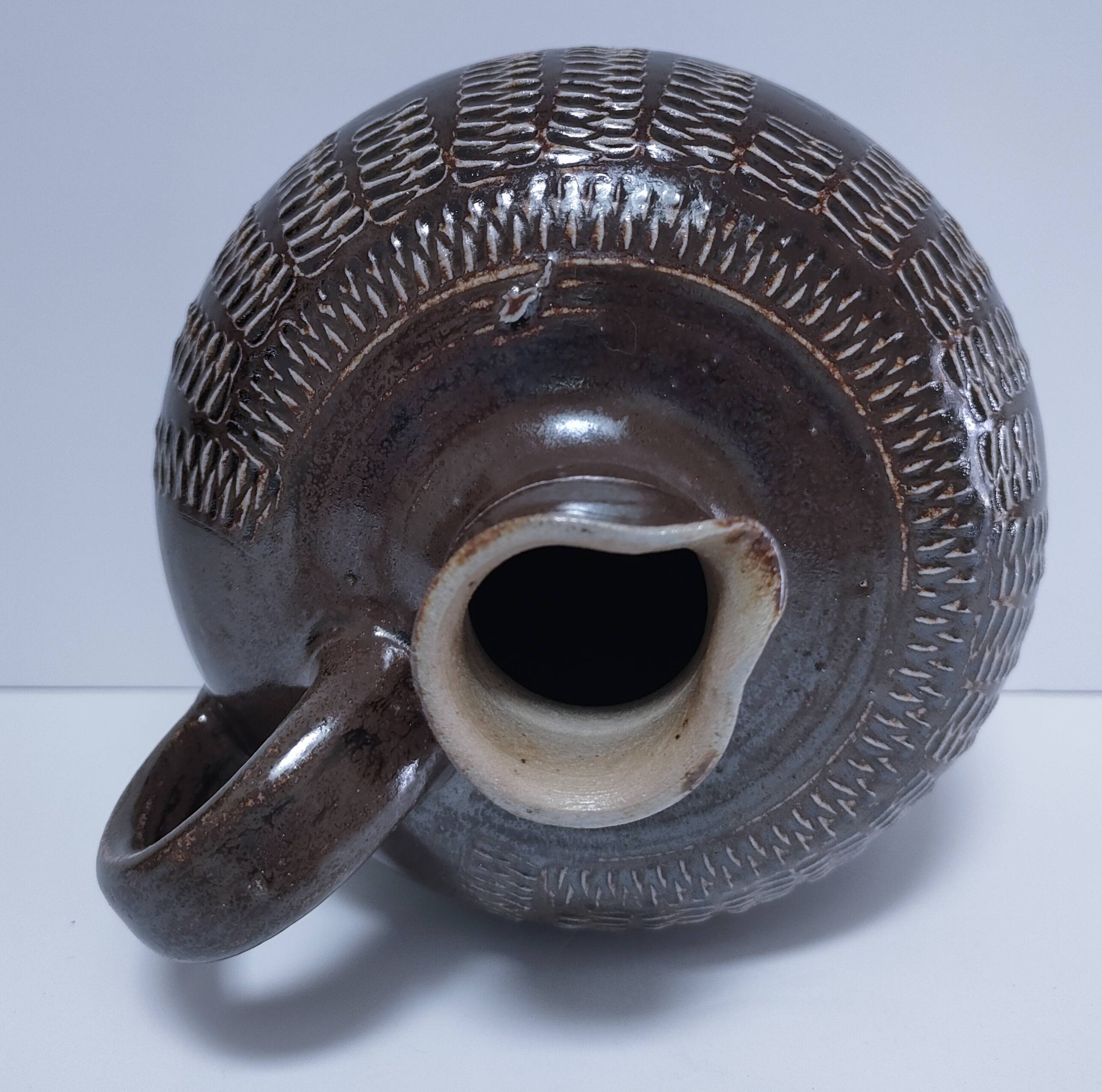 Vintage scarified glazed stoneware pitcher