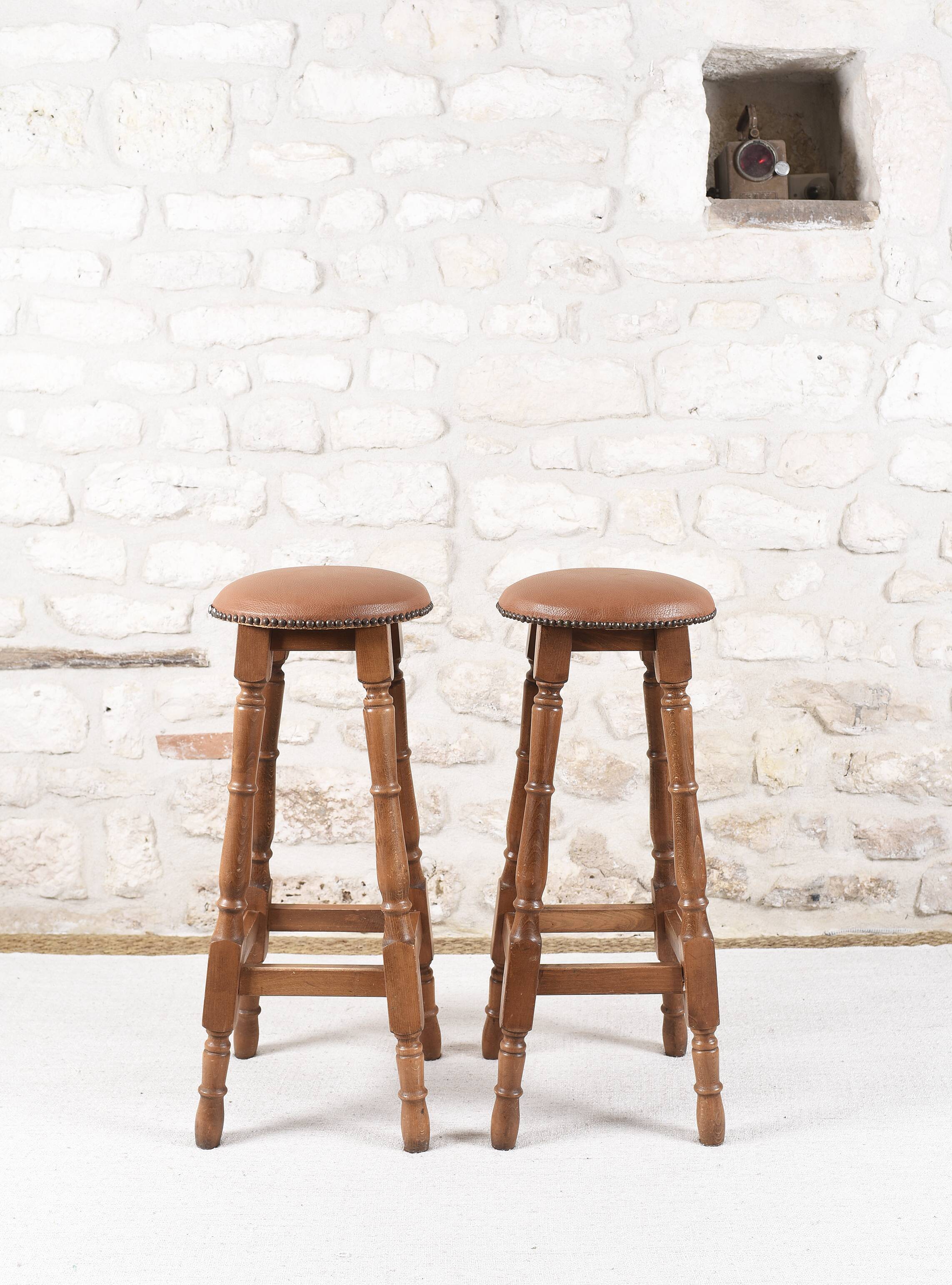 Antique bar stools, brown leather and wood