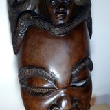 Enigmatic face of Africa carved in ebony wood
