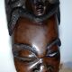Visage énigmatique d'Afrique sculpté en bois d'ébène