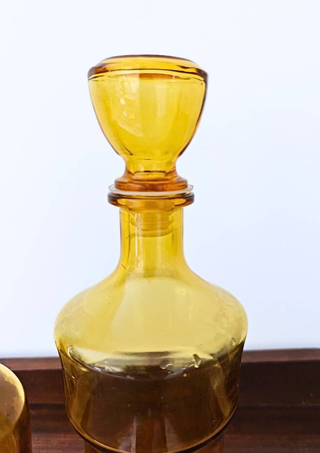Set of two vintage amber glass carafes attributed to Lubiana.