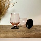 6 small pink glasses with black stems
