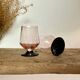 6 small pink glasses with black stems