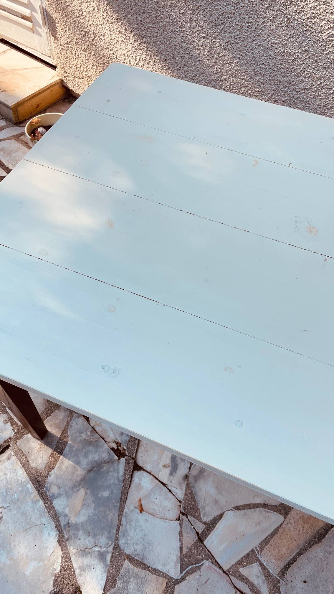Vintage oak farmhouse table with a white top.