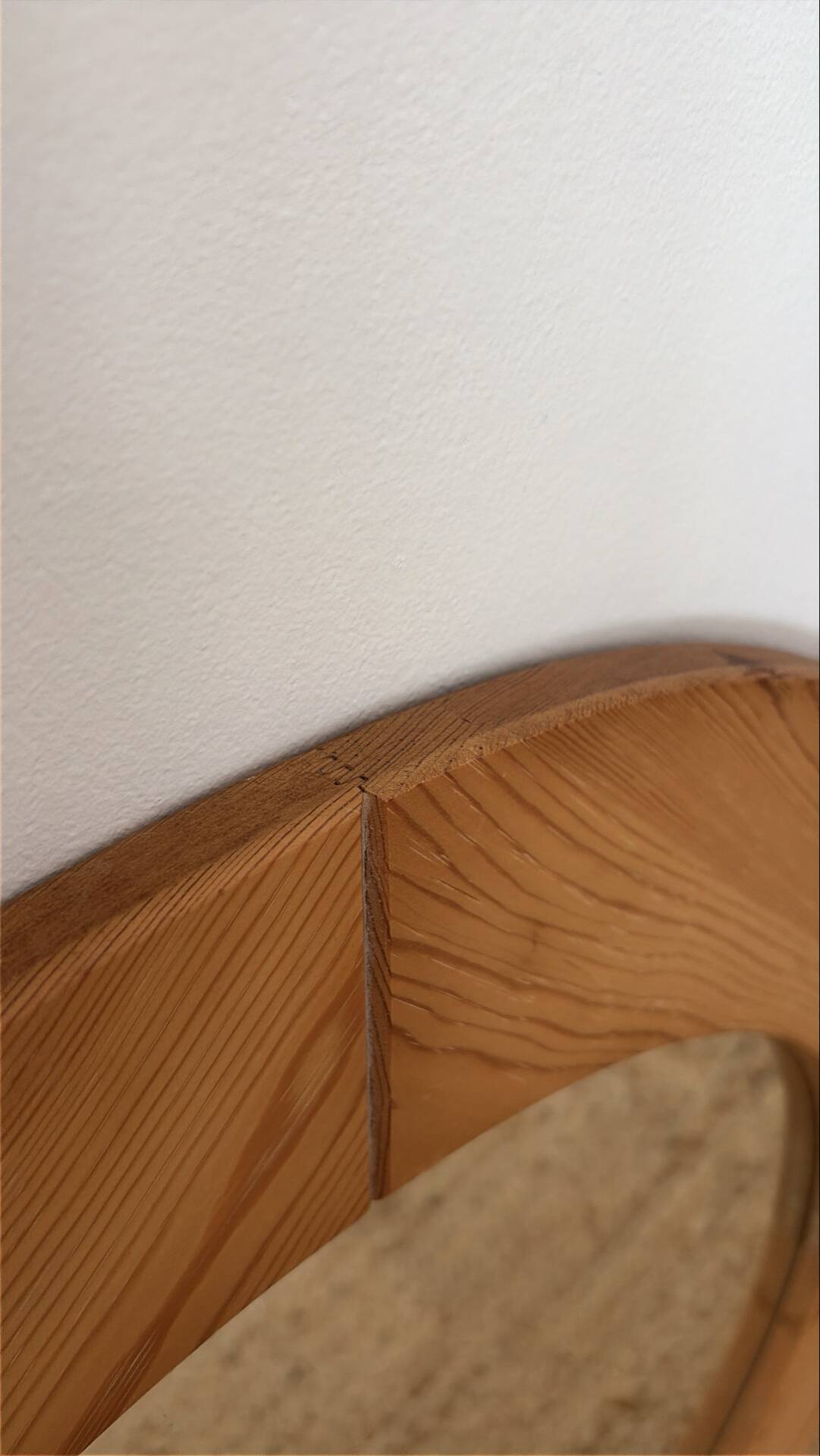 Round Scandinavian pine mirror from the 1970s.