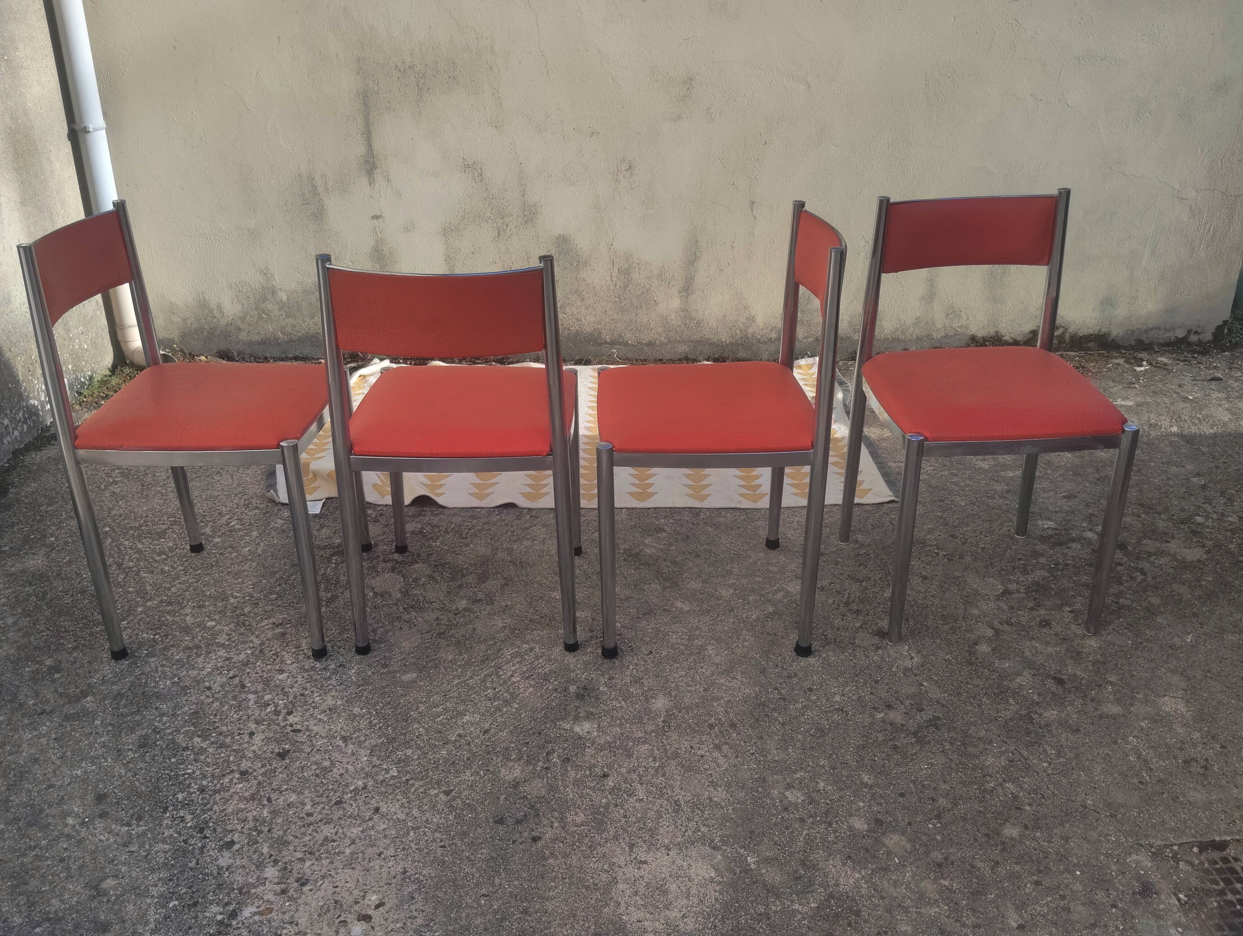 Set of 4 vintage chrome and orange faux leather chairs.