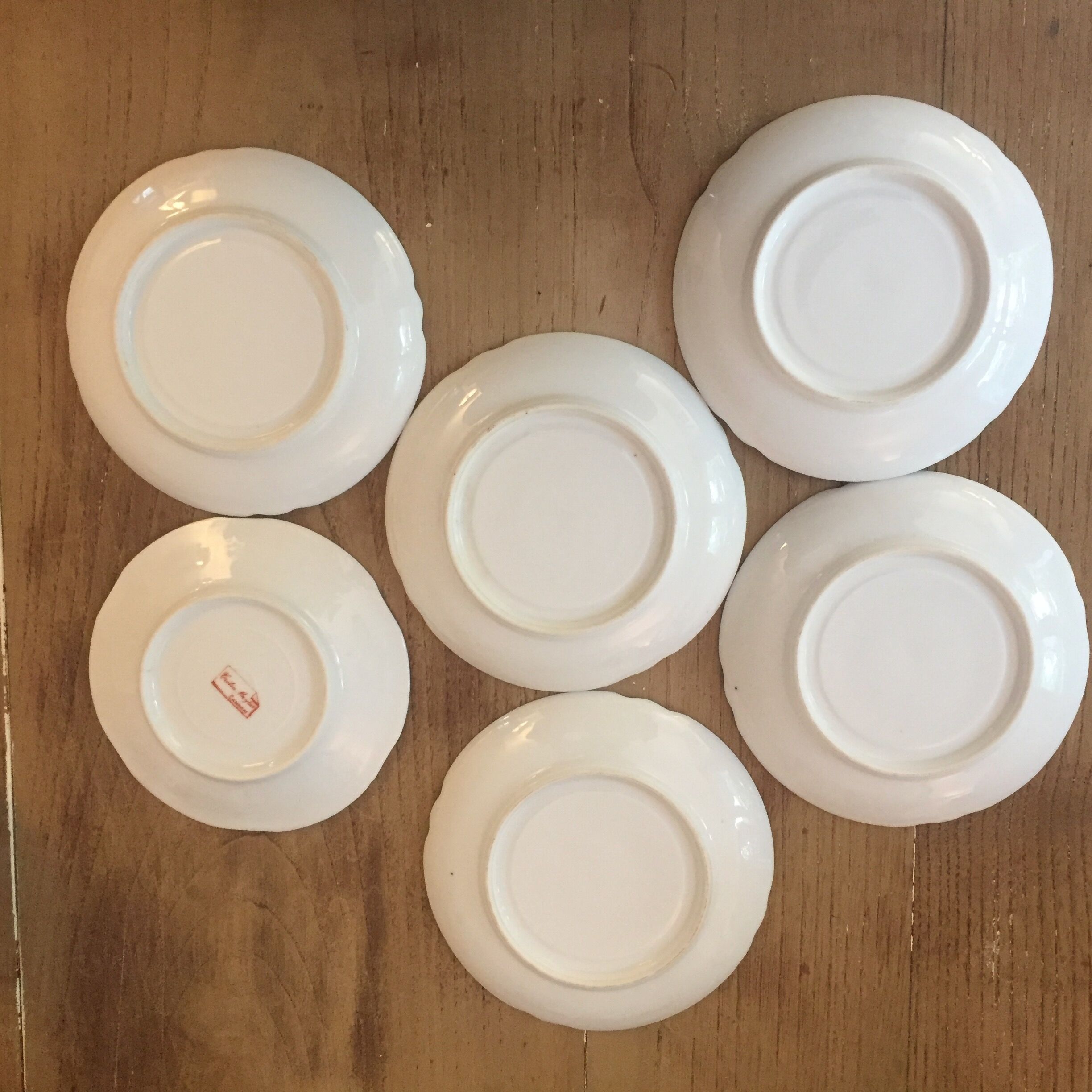 6 antique cups and mismatched saucers