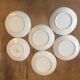 6 antique cups and mismatched saucers
