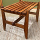 Small modernist wooden bench with vintage slats.