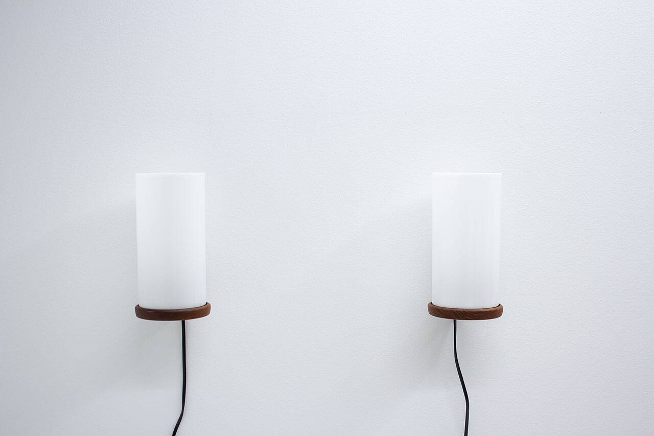 Pair of teak & acrylic sconces by Luxus, Sweden