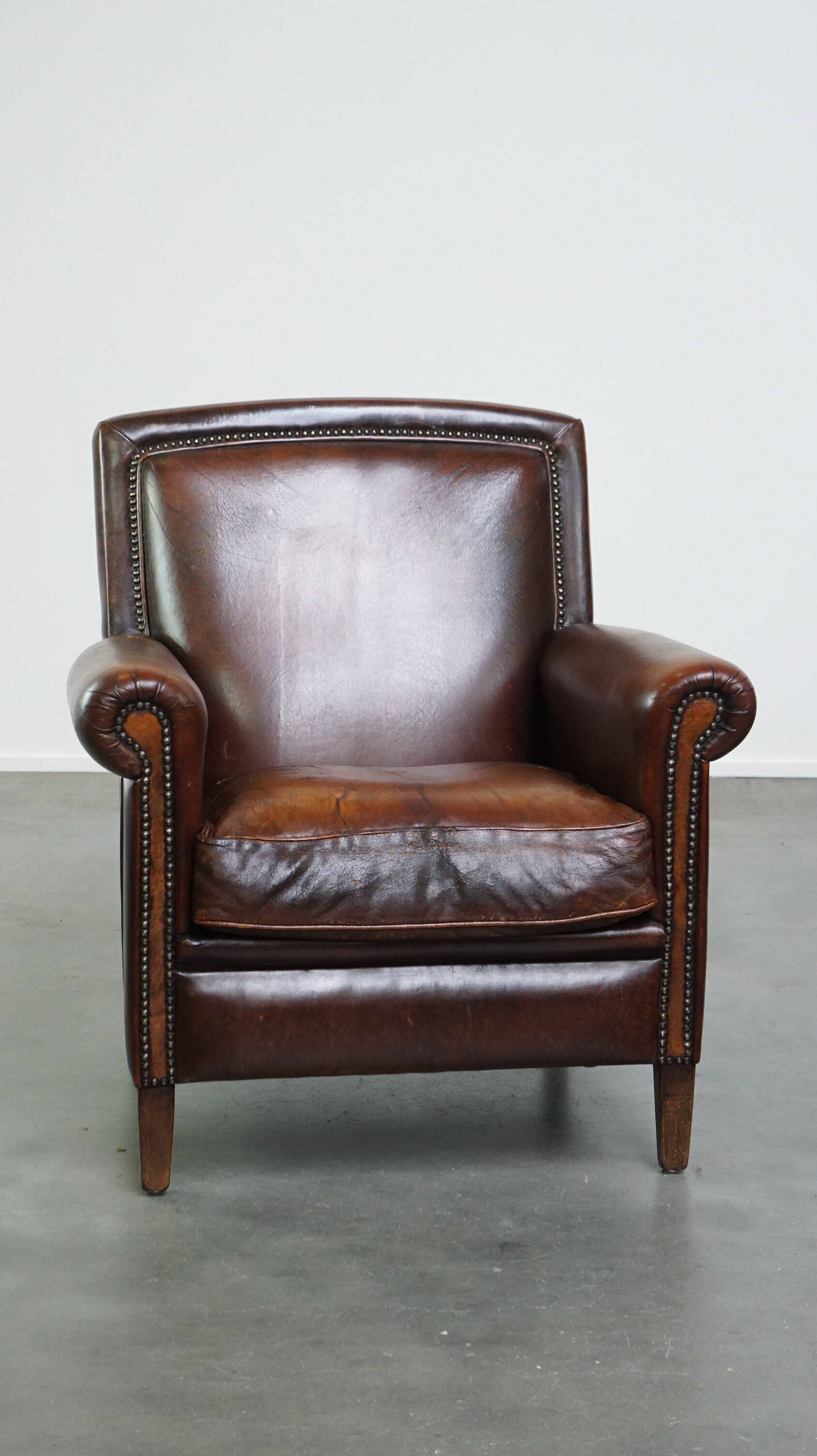 Vintage sheepskin armchair with beautiful warm colors and excellent seating comfort