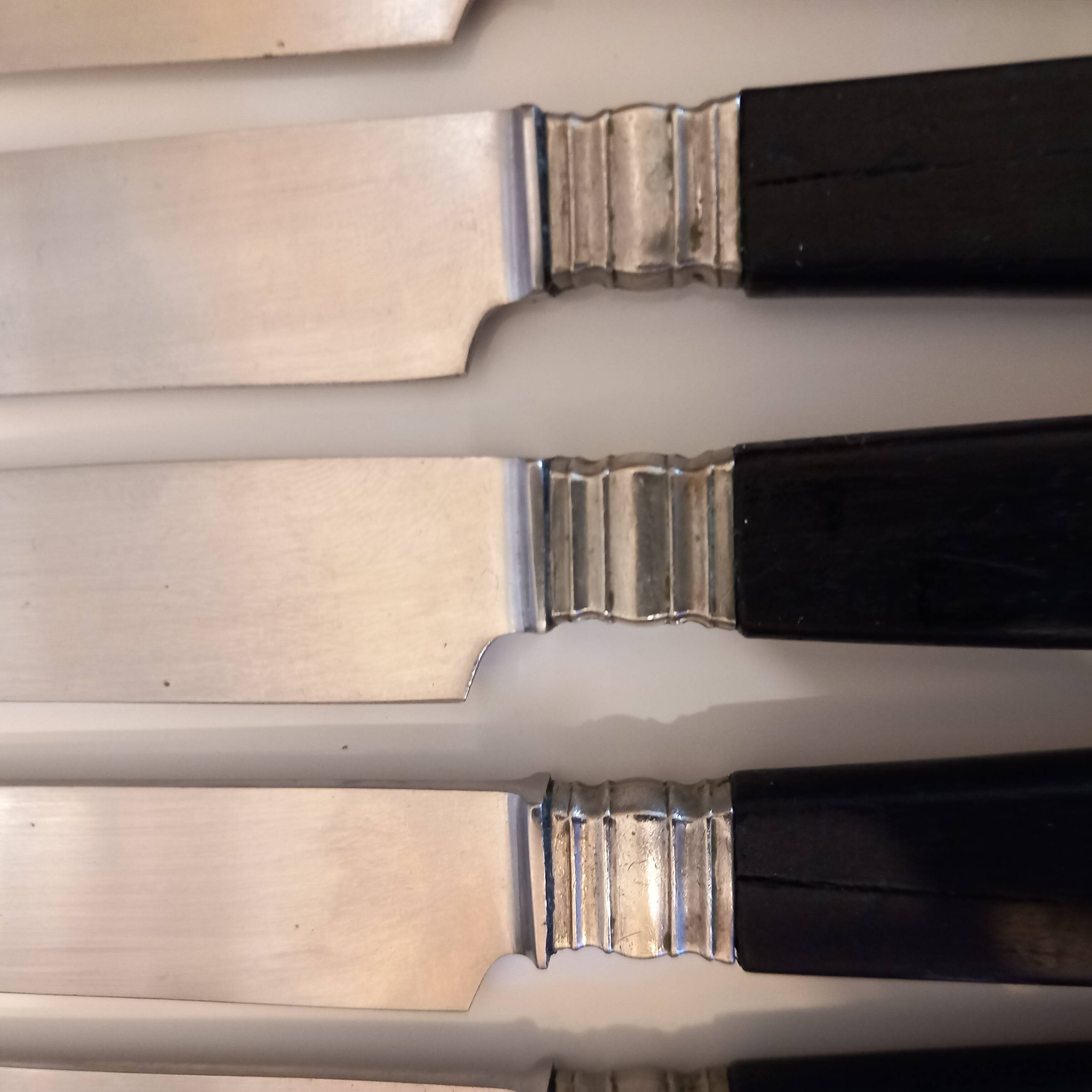 12 black Empire style table knives with silver ferrule Gimel