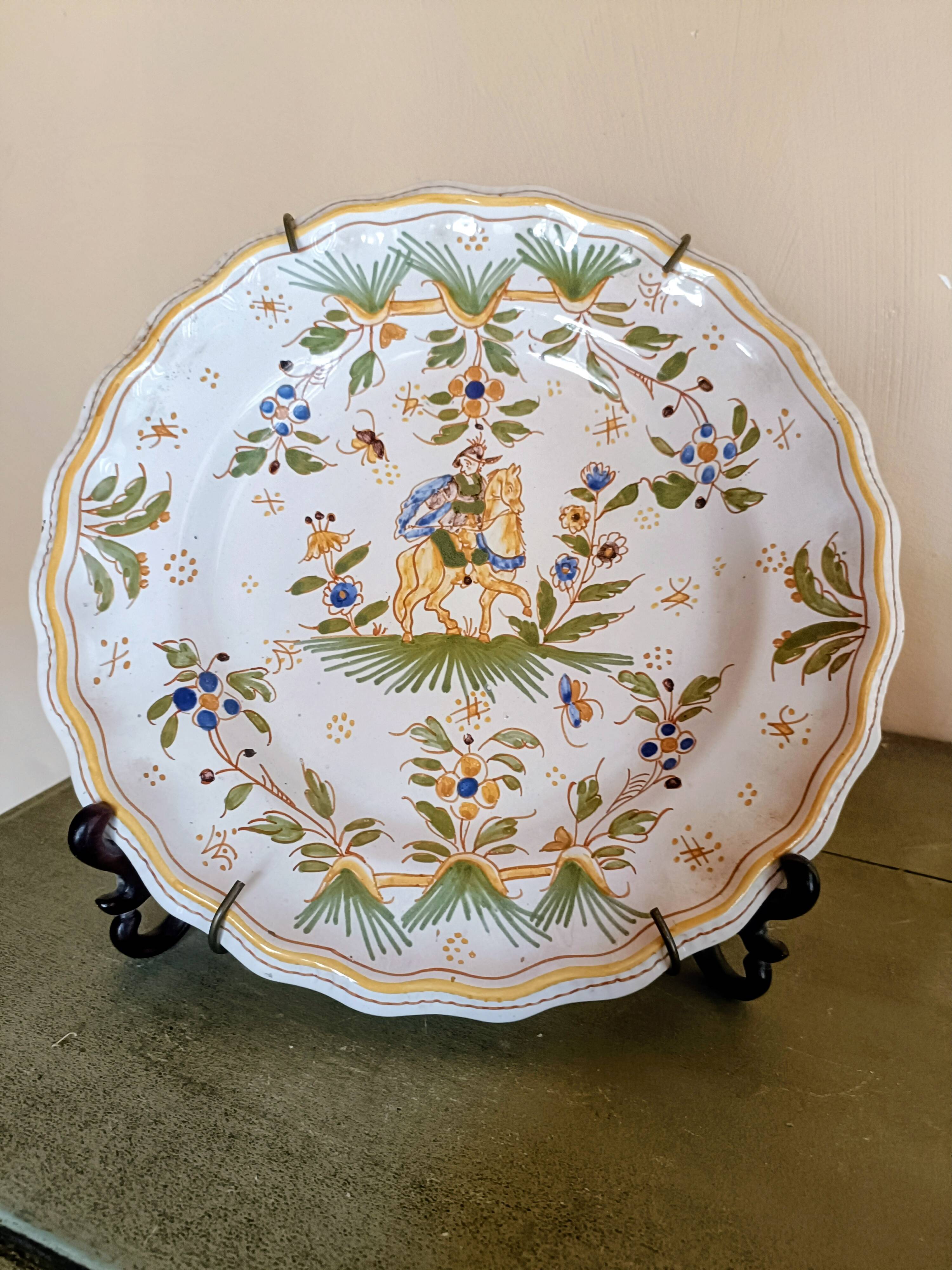 Antique Moustiers plate hand-decorated with a horseman.